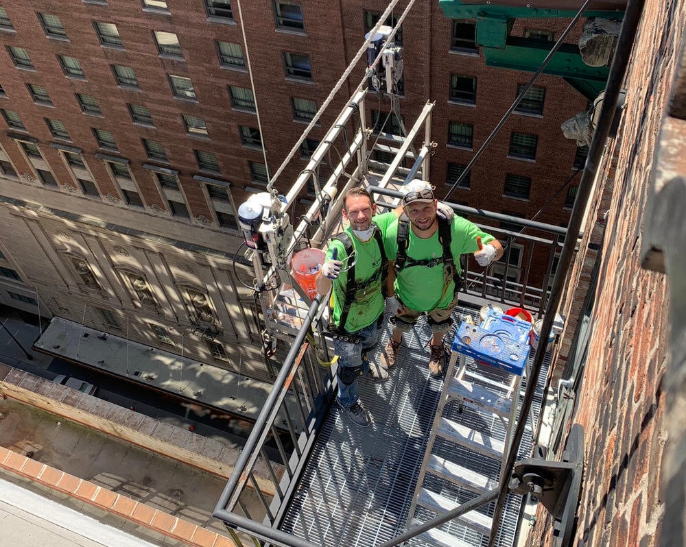 high-rise building balconies painting chicago