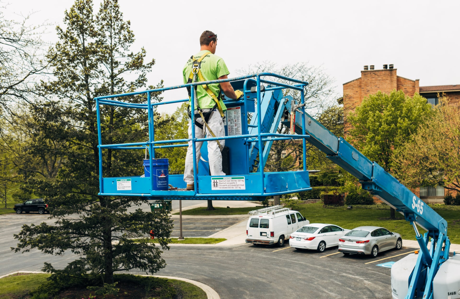 painter on high reach machine